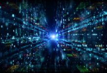 Digital cyberspace with data particles merging towards a central light.