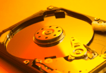 Open hard disk drive on yellow light.