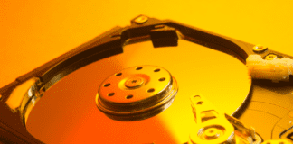 Open hard disk drive on yellow light.